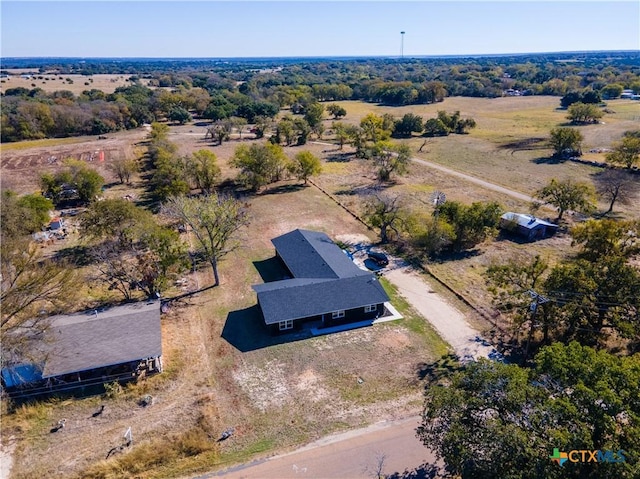 birds eye view of property with a rural view