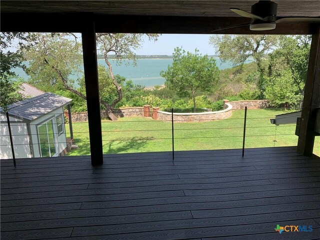 164 Buck Ln, Belton, TX 76513 - deck featuring ceiling fan, a water view, and a lawn