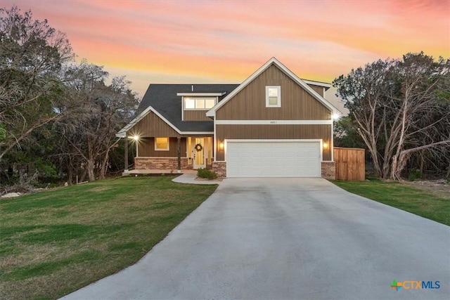4851 Goliad Dr, Temple, TX 76502 - craftsman house featuring a yard, concrete driveway, a garage, and stone siding