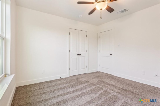 4851 Goliad Dr, Temple, TX 76502 - unfurnished bedroom featuring a closet, a ceiling fan, visible vents, carpet flooring, and baseboards