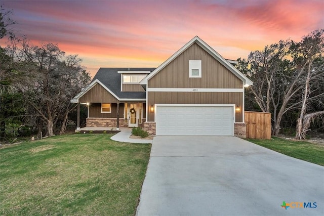 4851 Goliad Dr, Temple, TX 76502 - craftsman inspired home featuring roof mounted solar panels, stone siding, a lawn, a garage, and driveway