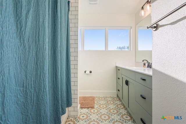 4851 Goliad Dr, Temple, TX 76502 - bathroom with tile patterned flooring, vanity, baseboards, and a shower with curtain