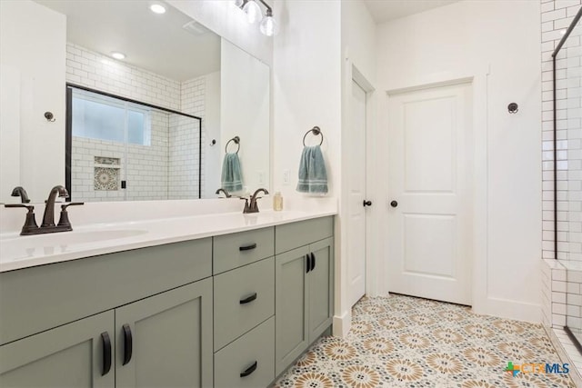 4851 Goliad Dr, Temple, TX 76502 - bathroom featuring a shower stall, double vanity, a sink, and recessed lighting