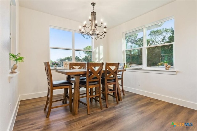 4851 Goliad Dr, Temple, TX 76502 - dining room featuring baseboards, an inviting chandelier, and wood finished floors