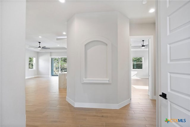 20029 Continental Dr, Lago Vista, TX 78645 - hallway with light wood finished floors, baseboards, and recessed lighting