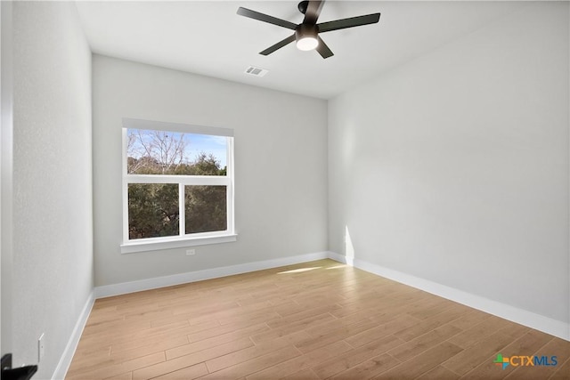 20029 Continental Dr, Lago Vista, TX 78645 - spare room with light wood-style floors, a ceiling fan, and baseboards