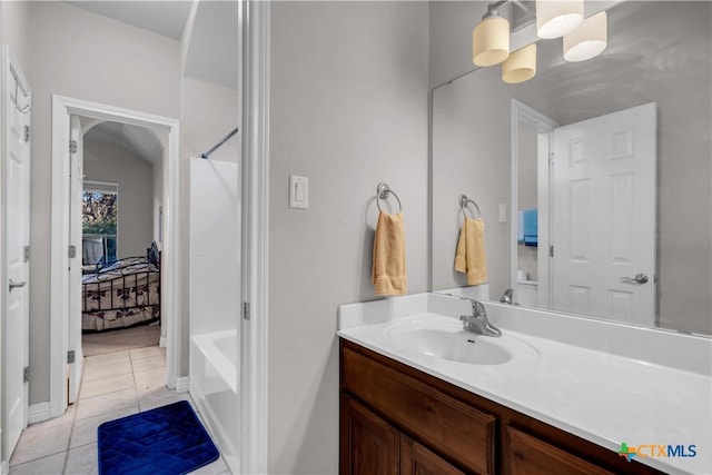 bathroom featuring bathing tub / shower combination, tile patterned flooring, and vanity