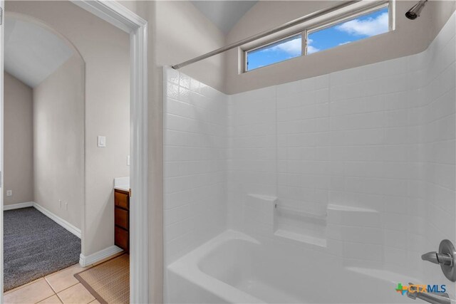 bathroom with tile patterned flooring, vanity, a healthy amount of sunlight, and tub / shower combination