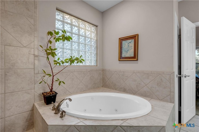 bathroom featuring tiled tub