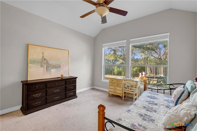 bedroom with ceiling fan, light carpet, and vaulted ceiling