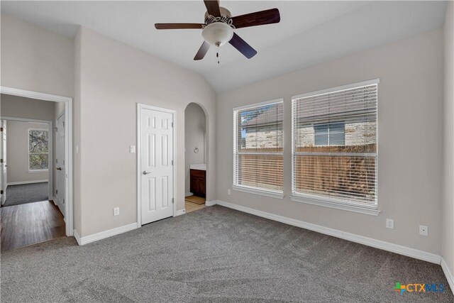 bedroom with multiple windows, ceiling fan, and vaulted ceiling