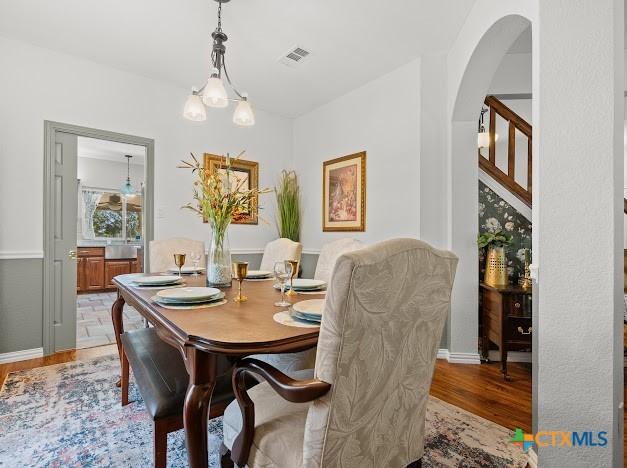 405 Arapaho Dr, Harker Heights, TX 76548 - dining area with light wood finished floors and arched walkways