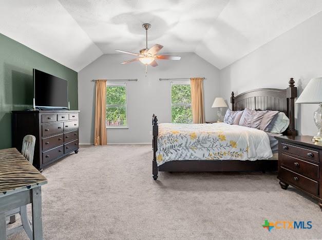 405 Arapaho Dr, Harker Heights, TX 76548 - bedroom featuring vaulted ceiling, light colored carpet, and ceiling fan