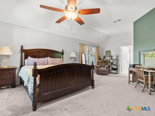 405 Arapaho Dr, Harker Heights, TX 76548 - bedroom with lofted ceiling, carpet floors, multiple windows, and ceiling fan