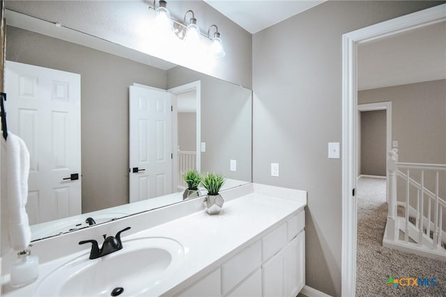 bathroom with vanity and baseboards