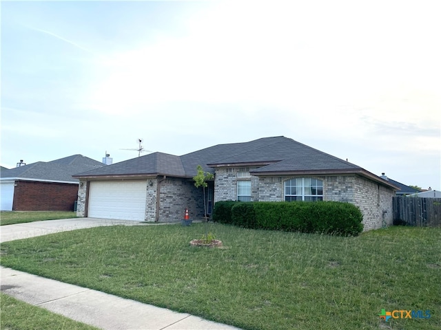 4803 Addie Dr, Killeen, TX 76542 - ranch-style house featuring an attached garage, brick siding, driveway, and a shingled roof