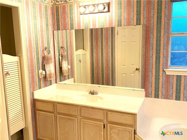 4803 Addie Dr, Killeen, TX 76542 - bathroom featuring wallpapered walls and vanity
