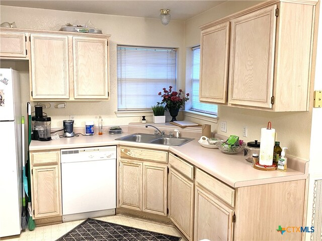 4803 Addie Dr, Killeen, TX 76542 - kitchen with white appliances, a sink, light brown cabinetry, and light countertops