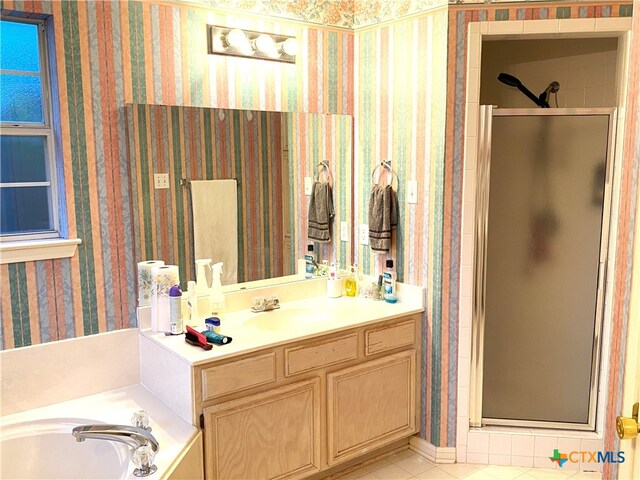 4803 Addie Dr, Killeen, TX 76542 - bathroom with wallpapered walls, a shower stall, vanity, a bath, and tile patterned floors