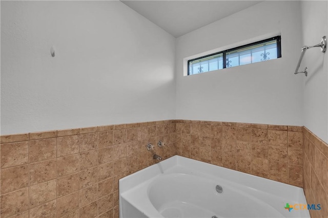 full bath with a garden tub