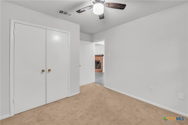 unfurnished bedroom with carpet and baseboards
