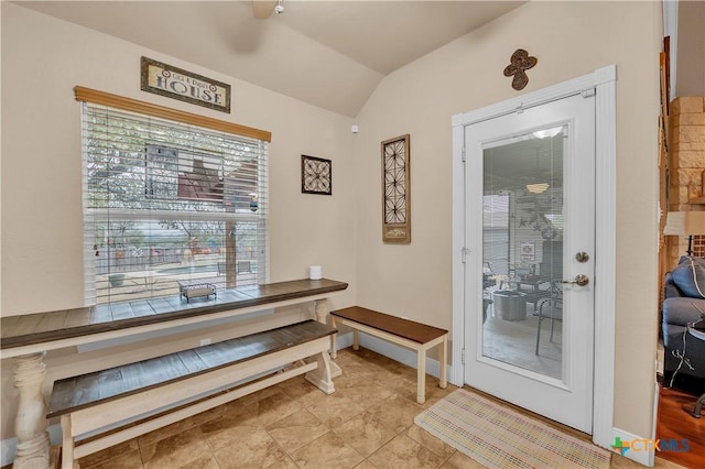 dining area featuring lofted ceiling