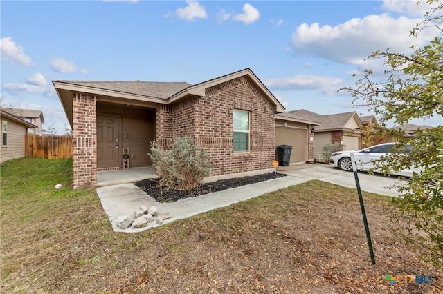 ranch-style home featuring a front yard and a garage