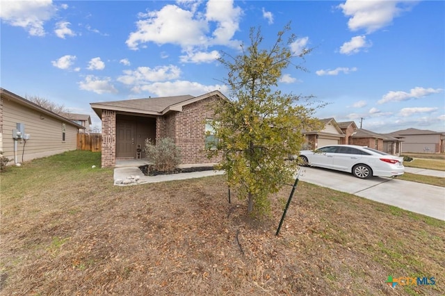 ranch-style home with a front yard