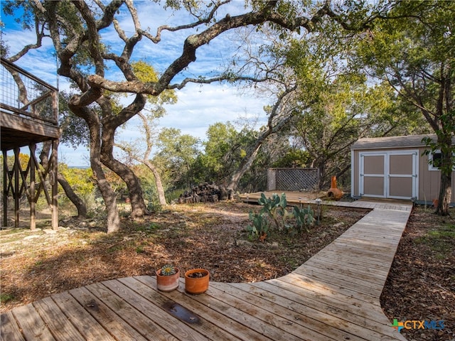 wooden terrace featuring a storage unit