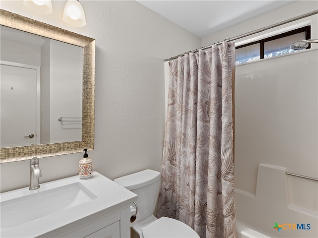 full bathroom featuring vanity, toilet, and shower / bathtub combination with curtain