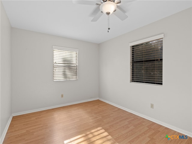 unfurnished room featuring ceiling fan and light hardwood / wood-style flooring