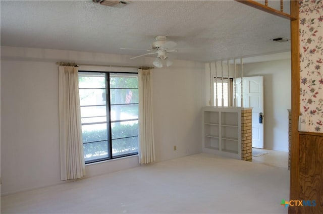 303 E 20th Ave, Belton, TX 76513 - unfurnished room featuring a ceiling fan, a textured ceiling, and carpet