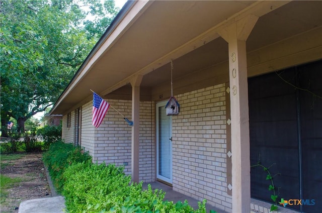 303 E 20th Ave, Belton, TX 76513 - property entrance featuring brick siding