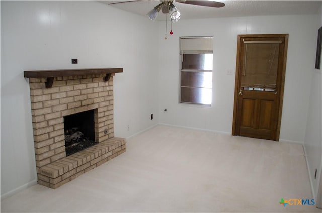 303 E 20th Ave, Belton, TX 76513 - unfurnished living room featuring a ceiling fan, carpet flooring, and a fireplace