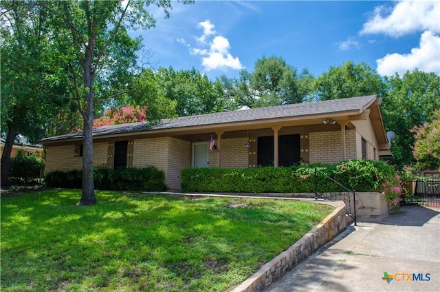 303 E 20th Ave, Belton, TX 76513 - single story home with brick siding and a porch