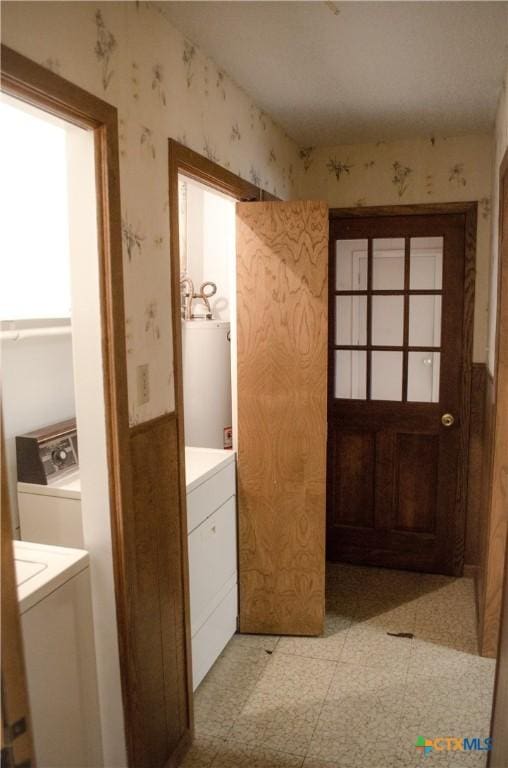 303 E 20th Ave, Belton, TX 76513 - laundry room featuring water heater, light floors, wallpapered walls, and washer and dryer
