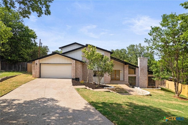 910 Cliffside Dr, Harker Heights, TX 76548 - mid-century modern home featuring brick siding, an attached garage, concrete driveway, and a chimney