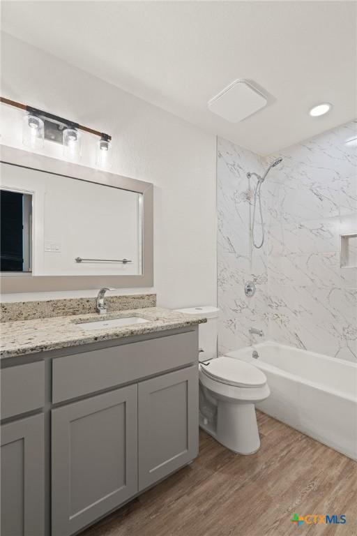 910 Cliffside Dr, Harker Heights, TX 76548 - bathroom with vanity, shower / tub combination, toilet, and wood finished floors