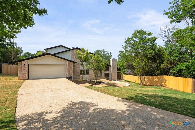 910 Cliffside Dr, Harker Heights, TX 76548 - view of front of property featuring brick siding, an attached garage, and driveway