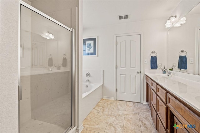 bathroom with independent shower and bath and vanity