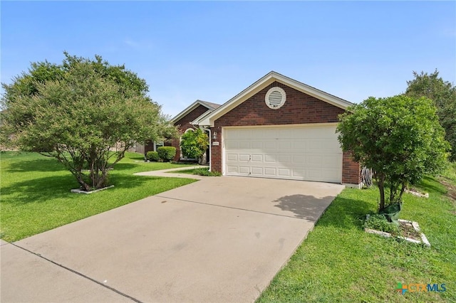 5608 Drystone Ln, Killeen, TX 76542 - view of front of house with brick siding, concrete driveway, a front yard, and a garage