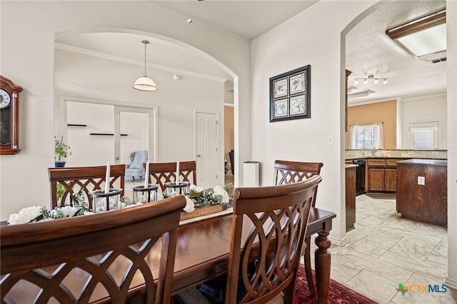 dining room featuring ornamental molding