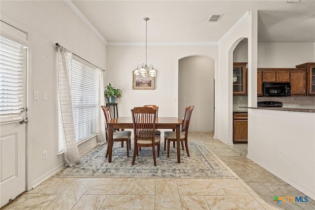 dining space featuring ornamental molding