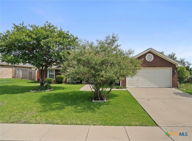 5608 Drystone Ln, Killeen, TX 76542 - obstructed view of property featuring concrete driveway, brick siding, and a garage