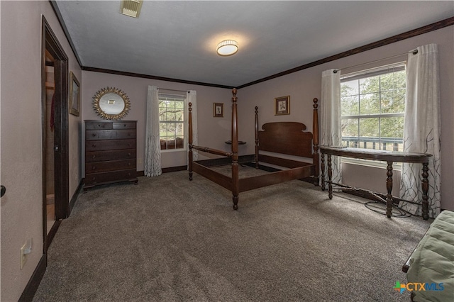 bedroom featuring ornamental molding and carpet