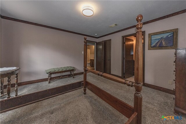 living area with ornamental molding and carpet