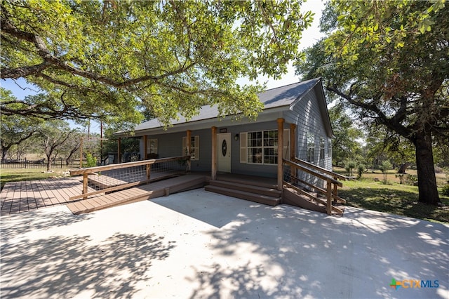 view of front of home featuring a wooden deck