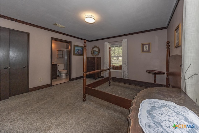 bedroom with connected bathroom, a textured ceiling, carpet floors, and ornamental molding