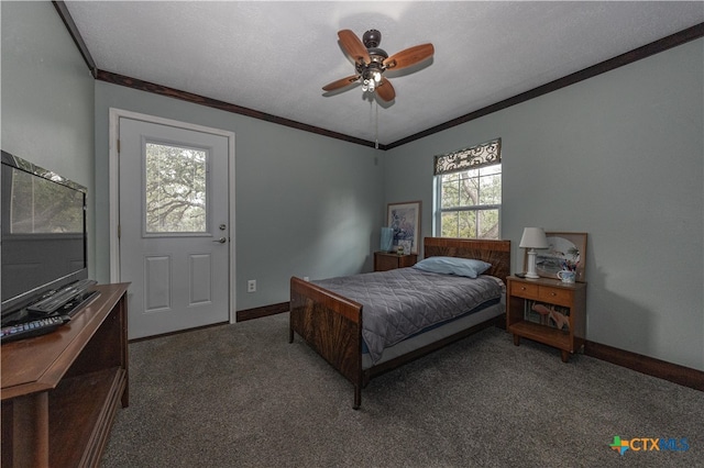 carpeted bedroom with a textured ceiling, ceiling fan, and crown molding