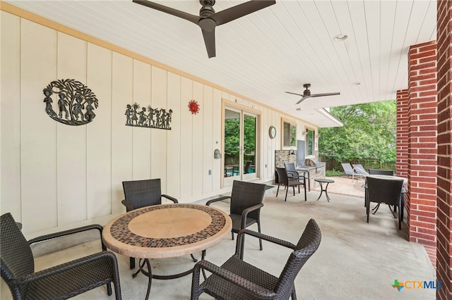 view of patio with a ceiling fan and outdoor dining space